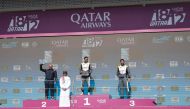 QMMF Executive Director and CEO of Lusail International Circuit Amro Al Hamad poses with the podium winners of Qatar Touring Car Championship.