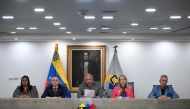The President of Venezuela's National Electoral Council (CNE), Elvis Amoroso (C), speaks next to rectors Aime Nogal (L), Carlos Quintero (2-L), Rosalba Gil (2-R), and Juan Carlos Delpino (R) during a press conference at the CNE headquarters in Caracas on March 5, 2024. (Photo by Federico Parra / AFP)
