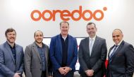 Ooredoo Group and Dropbox officials during the partnership signing.