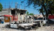 Charred vehicles remain parked as gang violence escalates in Port-au-Prince, Haiti, on March 9, 2024. (Photo by Clarens SIFFROY / AFP)
