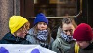 Swedish climate activist Greta Thunberg (2nd L) and a group of fellow activists block the main entrances of the Swedish Parliament during a protest due to the lack of action from the Swedish authorities, on March 11, 2024, in Stockholm, Sweden. (Photo by Jonathan NACKSTRAND / AFP)