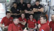 In this screen grab from NASA's feed, ESA (European Space Agency) astronaut Andy Mogensen (L) hands over command of the International space station to Roscosmos cosmonauts Oleg Kononenko as Mogensen prepares to head home with his Crew-7 crewmates. (Photo by Handout / NASA TV / AFP)