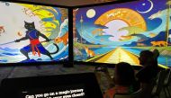 SXSW attendees watch The Golden Key, a never ending story generated and narrated by AI with input from spectators answering questions in Austin, Texas, recently. (AFP)