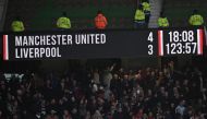 The scoreboard displays the final score after extra-time in the English FA Cup Quarter Final football match between Manchester United and Liverpool at Old Trafford in Manchester, north west England, on March 17, 2024. Manchester United won the game 4-3 after extra-time. (Photo by Paul ELLIS / AFP)