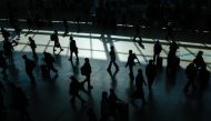 Commuters walk inside a train station in Seoul on March 18, 2024. (Photo by Anthony WALLACE / AFP)