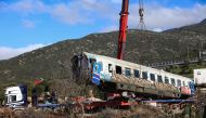 Technical crews remove a train carriage from the scene of February 28's train accident in the valley of Tempi, near Larissa, on March 3, 2023. (Photo by STRINGER / AFP)
