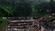 Partial view of the municipal cemetery of Petropolis, where several niches were damaged when they collapsed due to the heavy rains in Petropolis, Brazil on March 2024. (Photo by Pablo PORCIUNCULA / AFP)
