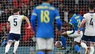 Brazil's striker #21 Endrick (2R) shoots to score the only goal of the international friendly football match between England and Brazil at Wembley stadium in north London on March 23, 2024. Brazil won the game 1-0. (Photo by Glyn KIRK / AFP)