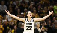 Guard Caitlin Clark #22 of the Iowa Hawkeyes celebrates after drawing a foul late in the second half against the West Virginia Mountaineers during their second round match-up in the 2024 NCAA Division 1 Women's Basketball Championship at Carver-Hawkeye Arena on March 25, 2024 in Iowa City, Iowa. (Photo by Matthew Holst / GETTY IMAGES NORTH AMERICA / Getty Images via AFP)
