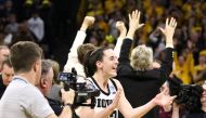 Guard Caitlin Clark #22 of the Iowa Hawkeyes celebrates after the game against the West Virginia Mountaineers during their second round match-up in the 2024 NCAA Division 1 Women's Basketball Championship at Carver-Hawkeye Arena on March 25, 2024 in Iowa City, Iowa. (Photo by Matthew Holst / GETTY IMAGES NORTH AMERICA / Getty Images via AFP)
