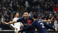 Paris Saint-Germain's Portuguese forward #09 Goncalo Ramos (L) celebrates with Paris Saint-Germain's Moroccan defender #02 Achraf Hakimi after scoring his team's second goal during the French L1 football match between Olympique Marseille (OM) and Paris Saint-Germain (PSG) at Stade Velodrome in Marseille, southeastern France, on March 31, 2024. (Photo by CHRISTOPHE SIMON / AFP)
