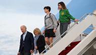 US President Joe Biden and First Lady Jill Biden disembark Air Force One with their grandchildren Natalie and Hunter at Joint Base Andrews in Maryland on January 2, 2023. (Photo by SAUL LOEB / AFP)

