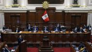 Peru's Prime Minister Gustavo Adrianzen (left) addresses the Congress to seek a vote of confidence to allow Peru's President Dina Boluarte to remain in office despite a luxury watch scandal that is rocking the government, at the National Congress in Lima, on April 3, 2024. (Photo by Juan Carlos Cisneros / AFP)
