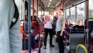 Swedish climate activist Greta Thunberg stands in a public service bus after taking part in a climate march against fossil subsidies near the highway A12 in the Hague, on April 6, 2024. (Photo by Ramon van Flymen / ANP / AFP) 