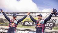 Nasser Saleh Al Attiyah (right) and his co-driver Edouard Boulanger celebrate their Rally-Raid Portugal triumph. 