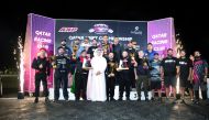 QRC Director Sheikh Jabor bin Khalid Al Thani poses for a group photo with the podium winners. 