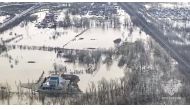 Grab taken from an aerial handout footage on April 9, 2024 shows flooded area in the Orenburg region, southeast of the southern tip of the Ural Mountains. (Photo by Handout / Russian Emergency Situations Ministry / AFP) 