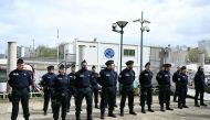 Members of the French police's River Brigade (Brigade Fluviale) wait to meet Minister for Interior and Overseas during a visit dedicated to the security measures ahead of the opening ceremony of the Olympics in Paris on April 9, 2024. Photo by MIGUEL MEDINA / AFP.