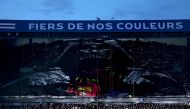 Barcelona's supporters unveil a giant banner with a depiction of the Star Wars Darth Vader wearing a Barcelona shirt in the stands ahead of the UEFA Champions League quarter final first leg football match between Paris Saint-Germain (PSG) and FC Barcelona at the Parc des Princes stadium in Paris on April 10, 2024. (Photo by Anne-Christine Poujoulat / AFP)

