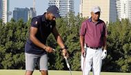 Qatar’s Saleh Al Kaabi (left) in action during the opening round of Qatar Open Amateur Golf Championship.  