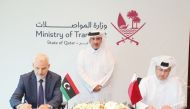 Minister of Transport H E Jassim Saif Ahmed Al Sulaiti (centre) looks on as In charge of managing the Qatar Civil Aviation Authority (QCAA) Mohammed Faleh Alhajri (right) and Head of the Libyan Civil Aviation Authority H E Dr. Mohammed Shalibak sign the agreement.