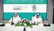 Officials signing a long-term agreement on 'Jeera' residential buildings.