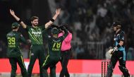 Pakistan's Shaheen Shah Afridi (2ndL) celebrates with teammates after taking the wicket of New Zealand's Jimmy Neesham (unseen) during the fifth and last Twenty20 international cricket match between Pakistan and New Zealand at the Gaddafi Cricket Stadium in Lahore on April 27, 2024. (Photo by Aamir QURESHI / AFP)