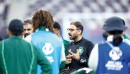Saudi Arabia coach Saad Al Shehri speaks to his players. AFC  