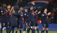 Paris Saint-Germain's French forward #07 Kylian Mbappe (C) and teammates applaud supporters at the end of the French L1 football match between Paris Saint-Germain (PSG) and Le Havre AC at the Parc des Princes Stadium in Paris on April 27, 2024. (Photo by FRANCK FIFE / AFP)
