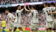Real Madrid's English midfielder #5 Jude Bellingham celebrates scoring his team's second goal during the Spanish league football match between Real Madrid CF and Cadiz CF at the Santiago Bernabeu stadium in Madrid on May 4, 2024. (Photo by OSCAR DEL POZO / AFP)
