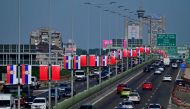 Photo taken on May 6, 2024, shows Chinese and Serbian flags along the high way trough Belgrade on the eve of the visit of Chinese President to Serbia. (Photo by Andrej ISAKOVIC / AFP)
