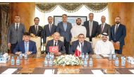 Turkish Ambassador to Qatar H E Dr. Mustafa Goksu , Aamal’s CEO Rashid Al Mansoori with other officials during the signing ceremony.