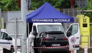 A forensic is at work at the site of a ramming attack which took place late morning at a road toll in Incarville in the Eure region of northern France, on May 14, 2024. Photo by ALAIN JOCARD / AFP.