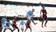 Manchester City's Norwegian striker #09 Erling Haaland (2R) jumps for a corner kick during the English Premier League football match between Manchester City and West Ham United at the Etihad Stadium in Manchester, north west England, on May 19, 2024. (Photo by Oli SCARFF / AFP) 