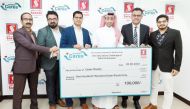 Managing Director of Safari Group of Companies, Shaheen Backer, and Safari’s management representatives handing over the cheque.