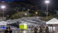The debris is seen covered with a tarp after a stage collapsed during a campaign rally for Mexican presidential candidate Jorge Alvarez Maynez in San Pedro Garza Garcia, Nuevo Leon, Mexico, on May 22, 2024. (Photo by Julio Cesar Aguilar / AFP)