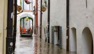 A boat with rescue helpers ships through a flooded street in the center of Passau in Bavaria, southern Germany, on June 4, 2024. Photo by Michaela STACHE / AFP