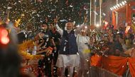 India's Prime Minister Narendra Modi flashes victory sign as he arrives at the Bharatiya Janata Party (BJP) headquarters to celebrate the party's win in country's general election, in New Delhi on June 4, 2024. (Photo by Arun Sankar / AFP)

