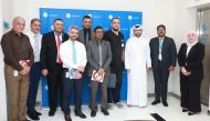 QIB officials pose for a group photo during the awareness day.