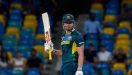 Australia's Marcus Stoinis celebrates after scoring a half-century (50 runs) during the ICC men's Twenty20 World Cup 2024 group B cricket match between Australia and Oman at Kensington Oval in Bridgetown, Barbados, on June 5, 2024. Photo by Randy Brooks / AFP.
