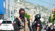 Police provide security outside the hospital where Haiti's new Prime Minister Garry Conille was hospitalised in Port-au-Prince, Haiti, June 9, 2024. (Photo by Clarens Siffroy / AFP)


