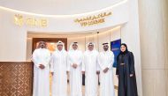 Officials pose for a group photo at the Premium VIP Lounge at Printemps Doha Oasis.
