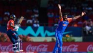 India's Jasprit Bumrah celebrates the dismissal of England's Jofra Archer (left) during the ICC men's Twenty20 World Cup 2024 semi-final cricket match between India and England at Providence Stadium in Georgetown, Guyana, on June 27, 2024. (Photo by Randy Brooks / AFP)