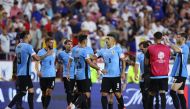 Luis Suarez of Uruguay and Cristian Olivera of Uruguay celebrate the team's victory after the CONMEBOL Copa America 2024 Group C match between United States and Uruguay on July 01, 2024 in Kansas City, Missouri. Jamie Squire/Getty Images/AFP 
