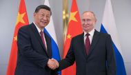 In this pool photograph distributed by the Russian state agency Sputnik, Russia's President Vladimir Putin meets with China's President Xi Jinping on the sidelines of the Shanghai Cooperation Organisation (SCO) member states leaders' summit in Astana on July 3, 2024. (Photo by Sergei GUNEYEV / POOL / AFP)

