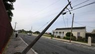 A light pole leans out of its foundation at National Heroes Park in Kingston, Jamaica, in the aftermath of Hurricane Beryl on July 4,2024. (Photo by Ricardo Makyn / AFP)
