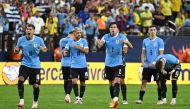 Uruguay's defender Mathias Olivera, midfielder Giorgian De Arrascaeta and defender Jose Maria Gimenez celebrate during a penalty shoot-out on July 6, 2024. (Photo by Robyn Beck / AFP)
