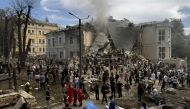 Rescuers clear the rubble of the destroyed Ohmatdyt Children's Hospital following a missile attack in Kyiv on July 8, 2024. (Photo by Roman Pilipey / AFP)