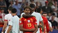 Spain's forward #19 Lamine Yamal and midfielder #17 Nico Williams celebrate their team's win at the end of the UEFA Euro 2024 semi-final football match between Spain and France at the Munich Football Arena in Munich on July 9, 2024. (Photo by JAVIER SORIANO / AFP)
