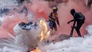 File: A tear gas canister explodes as protesters try to help injured people outside the Kenya Parliament during a nationwide strike to protest against tax hikes and the Finance Bill 2024 in downtown Nairobi, on June 25, 2024. (Photo by Luis Tato / AFP)